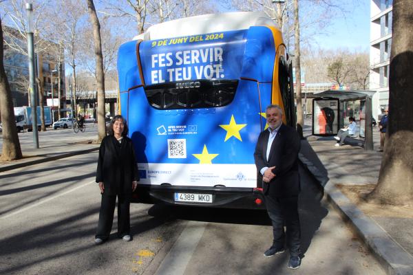 Picture showing the electric bus painted in the EU flag colours and the logo "Use your vote"